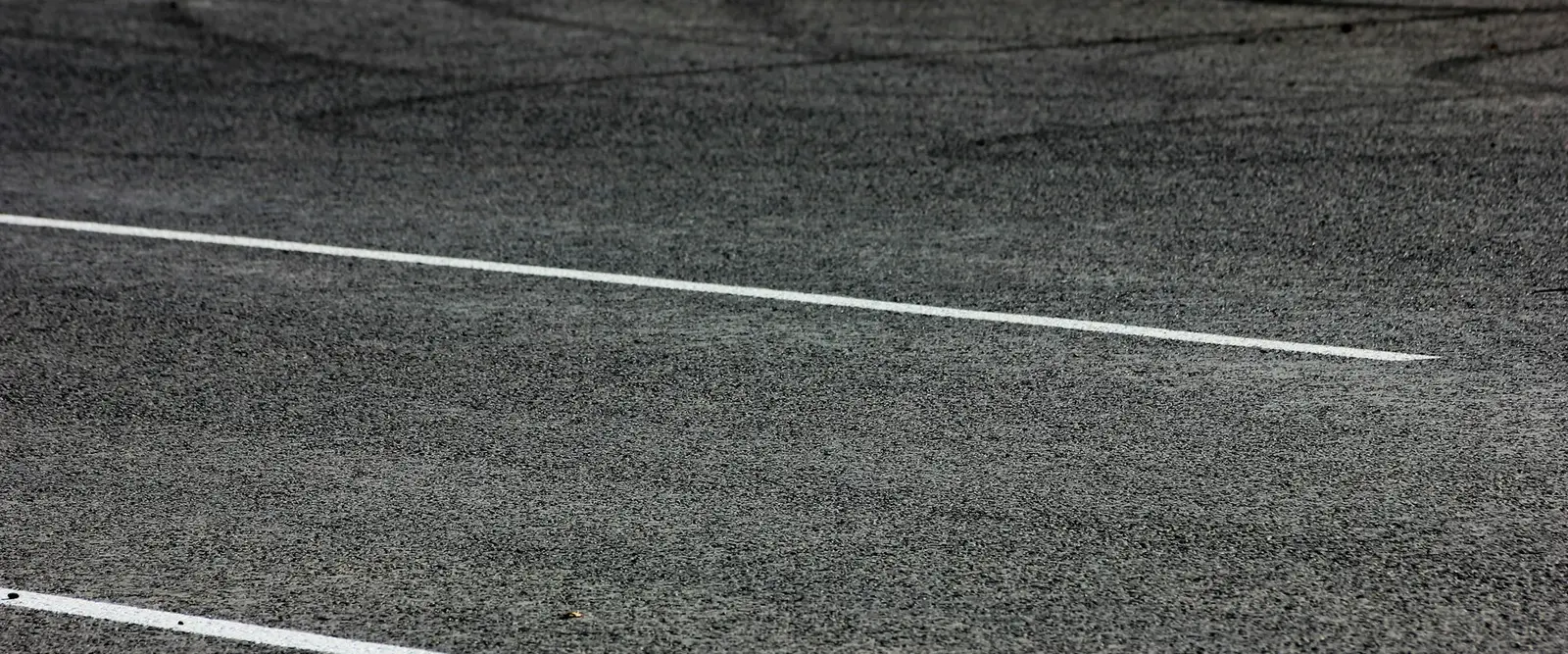 Fresh asphalt with a white painted line
